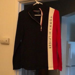 New without tags. It’s navy blue, red, cream with black letters. Fall/winter